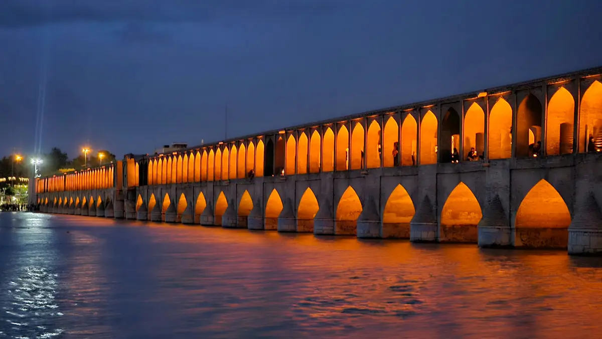 Si-o-se-pol bridge illuminated at night over the Zayanderud, Isfahan, Iran